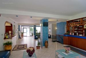 a lobby of a hotel with a bar in it at Hotel Gli Ulivi in Soverato Marina