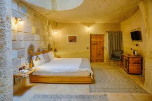 Postel nebo postele na pokoji v ubytování Design Cave Hotel