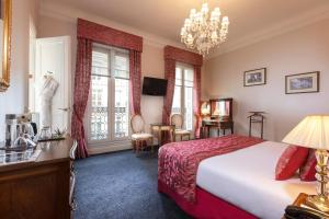 Postel nebo postele na pokoji v ubytování Hotel Claridge Paris