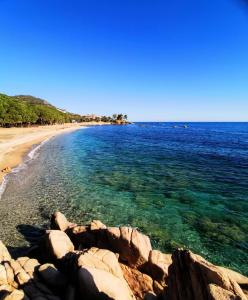 a view of a beach with rocks in the water at Casa Navarra in Santa Maria Navarrese