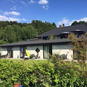 a white house with a black roof at Gästehaus Silvia in Freigericht