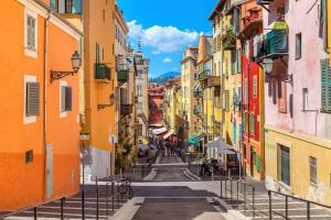 an alley between buildings in an old town at Aparthotel AMMI Vieux Nice in Nice