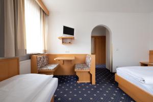 Ένα ή περισσότερα κρεβάτια σε δωμάτιο στο Garni Volgger