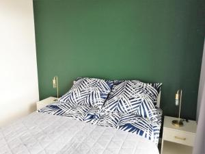 Posteľ alebo postele v izbe v ubytovaní Apartament Szmaragdowy