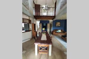 a living room with a table and a couch at Luxury Villa Nelspruit in Nelspruit +4 photos