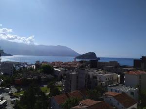 an aerial view of a city and the ocean at The Old Town Terrace Apartments in Budva