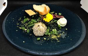 a blue plate with food on a table at Ferienhotel Sunshine in Berg im Drautal +14 photos