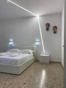Posteľ alebo postele v izbe v ubytovaní Catania Apartment Borgo Suite Autonomous