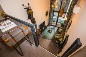 an overhead view of a living room with a fireplace at UrbanJungle - Your trendy loft in central Budapest in Budapest