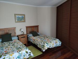 Posteľ alebo postele v izbe v ubytovaní Apartamentos Puerto O Grove
