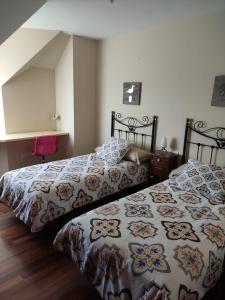 Posteľ alebo postele v izbe v ubytovaní Apartamentos Puerto O Grove