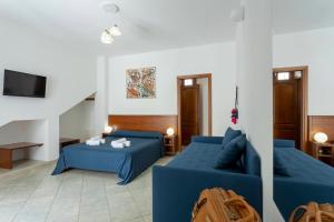 Ένα ή περισσότερα κρεβάτια σε δωμάτιο στο Poseidon Residence