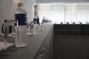 a bottle of water sitting on top of a counter at Hotel Diana del Bosque by DOT Urban in Morelia