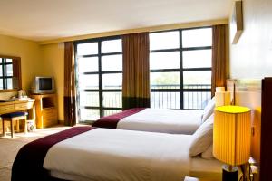 Voodi või voodid majutusasutuse Upton Court Hotel toas