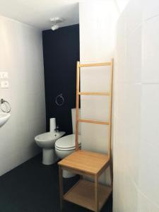a bathroom with a toilet and a sink at Dimora San Camillo in Catania