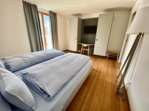 Postel nebo postele na pokoji v ubytování Hotel Müller - mountain lodge