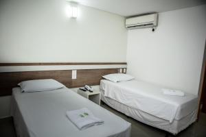 Postel nebo postele na pokoji v ubytování San Lucas Hotel