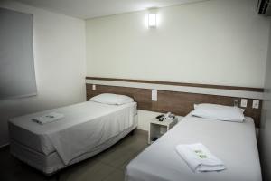 Postel nebo postele na pokoji v ubytování San Lucas Hotel