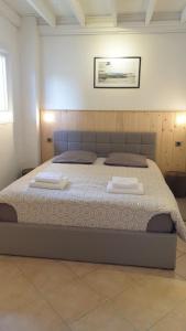 Säng eller sängar i ett rum på Figuier résidence Domaine Cap de Coste