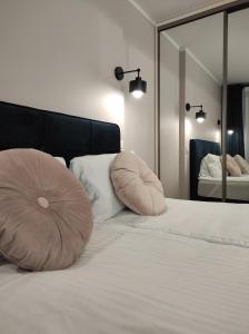 เตียงในห้องที่ Apartament Matejki 17 - Insel Apartamenty