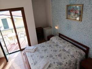 Postel nebo postele na pokoji v ubytování Parigino