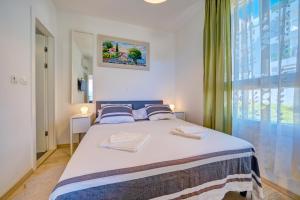 Posteľ alebo postele v izbe v ubytovaní Luxury Seaside Apartment by Litto