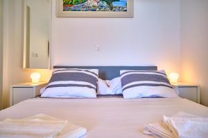 Posteľ alebo postele v izbe v ubytovaní Luxury Seaside Apartment by Litto