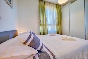 Posteľ alebo postele v izbe v ubytovaní Luxury Seaside Apartment by Litto