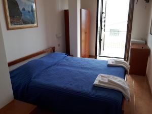 Postel nebo postele na pokoji v ubytování Parigino
