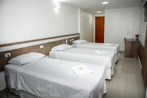 Postel nebo postele na pokoji v ubytování San Lucas Hotel