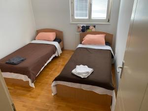 Ένα ή περισσότερα κρεβάτια σε δωμάτιο στο Apartman centar