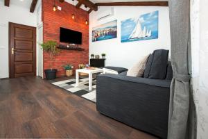 Telewizja i/lub zestaw kina domowego w obiekcie The Attic Rovinj