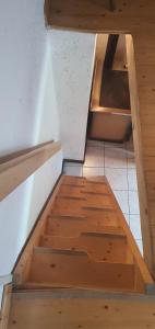 a set of wooden stairs in a room at Baita di montagna Stavel in Vermiglio