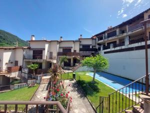a view of an apartment complex with a swimming pool at El Ático de Mijares in Mijares