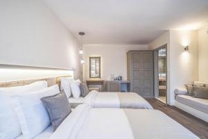 Postel nebo postele na pokoji v ubytování Elementa Boutique Hotel - Adults Only