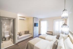 Postel nebo postele na pokoji v ubytování Elementa Boutique Hotel - Adults Only