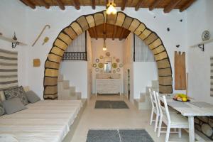 A bed or beds in a room at Rhodes Archangelos Traditional village house in with private yard
