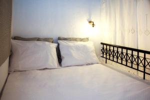 A bed or beds in a room at Rhodes Archangelos Traditional village house in with private yard