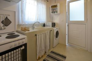 A kitchen or kitchenette at Rhodes Archangelos Traditional village house in with private yard