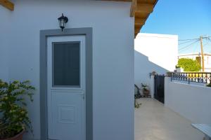 A balcony or terrace at Rhodes Archangelos Traditional village house in with private yard
