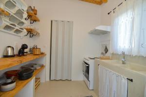 A kitchen or kitchenette at Rhodes Archangelos Traditional village house in with private yard