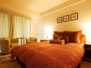 Postel nebo postele na pokoji v ubytování Hotel Villa Kuretake