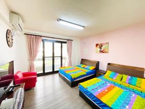 Posteľ alebo postele v izbe v ubytovaní Qilixiang Homestay