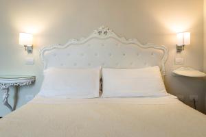 Posteľ alebo postele v izbe v ubytovaní Hotel Serenella