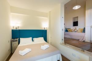 Posteľ alebo postele v izbe v ubytovaní Hotel Serenella