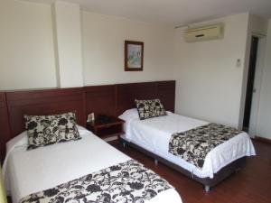 Hotel Don Lolo客房内的一张或多张床位