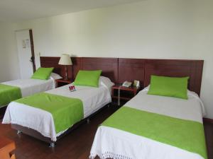 Hotel Don Lolo客房内的一张或多张床位