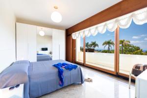 A bed or beds in a room at Villa Agave Még 37 kép