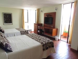 Hotel Don Lolo客房内的一张或多张床位