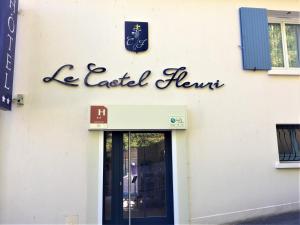 a sign on the side of a retail store at Castel Fleuri in Tours
